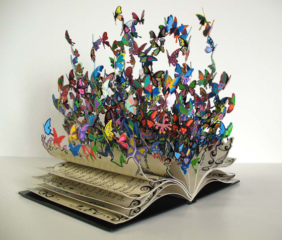 the-book-of-life-a-colorful-metal-art-sculpture-by-david-kracov-that-depicts-a-book-dissolving-into-butterflies